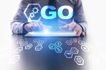 businessman is using tablet pc and selecting go icon.