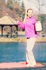 Girl with tablet in park.