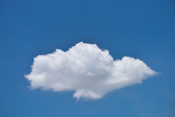 Wall Mural - single white cloud on blue sky