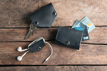 Poster - Leather wallet and accessories on wooden table