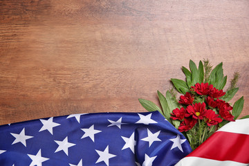 Wall Mural - Flowers and American flag on a wooden background