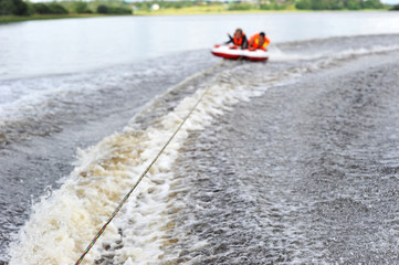 two people ride on a water tube