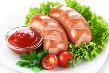 Wall Mural - Fried sausages with ketchup and lettuce on the plate