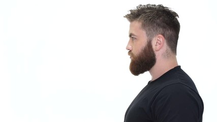 Poster - Side view of a handsome bearded brutal man looking away