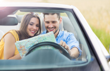 Wall Mural - Couple enjoying a drive in a convertible
