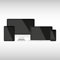 Wall Mural - set with dark screens computer notebook tablet and phone on a gray background