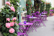 Paris Street Cafe With Bright Tables.