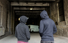 Addict Men Or Criminals In Hoodies On Street