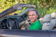 © Vivida Photo PC - puzzled man on convertible car