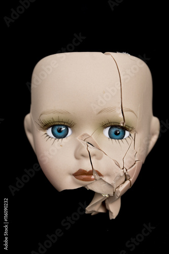 Fotografie, Obraz Broken Doll Face and Head on Black Background