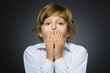 © dreamsnavigator - Closeup Portrait of handsome boy with astonished expression while standing against grey background
