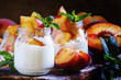 Dessert with sweet peaches, cottage cheese and whipped cream, se
