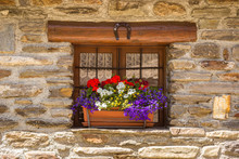 Wooden Window And Flowers On The Windowsill
