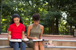 © PrimeLifePhotography - Young african american college student studying on campus