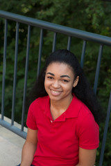 Wall Mural - Head shot of a young african american student on campus