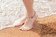 © photo_mts - legs of a young girl and anklet ankle