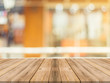 © tirachard - Wooden board empty table in front of blurred background. Perspective brown wood over blur in coffee shop - can be used for display or montage mock up your products. vintage filtered image.