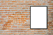 © tirachard - Mock up blank poster picture frame on brick wall.