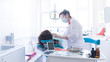 © greentellect - Dentist treats a patient