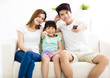 © Tom Wang - Happy Attractive Young  Family watching the tv