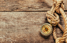 Ship Ropes And Compass On Wooden Background