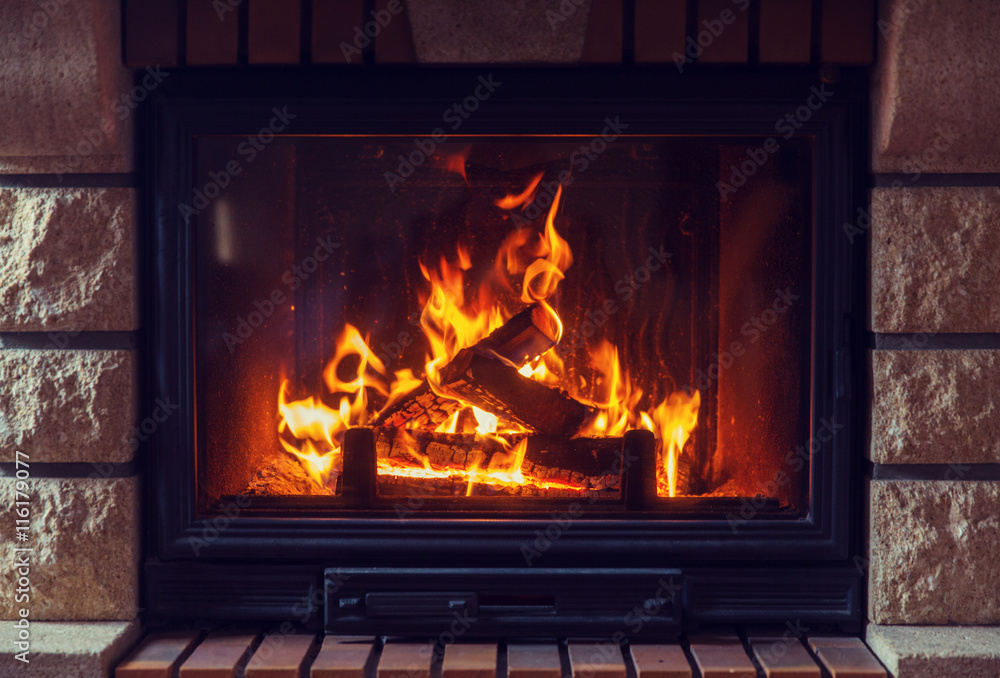 close up of burning fireplace at home - obrazy, fototapety, plakaty 