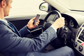 Poster - close up of man with smartphone driving car