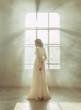 © kharchenkoirina - Lady in white vintage dress standing in a large spacious room , fantastic shot, fairytale princess turned into smoke , trendy toning , creative computer colors.
