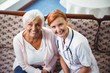 © WavebreakmediaMicro - Senior woman and nurse smiling at camera