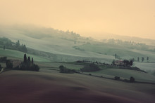 Beautiful Summer Morning Landscape With Foggy Hills And Tuscany Farm Houses, Travel Italian Background