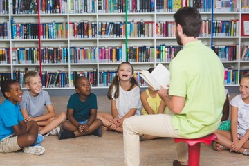 teacher teaching kids in library