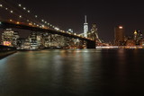 Fototapeta  - Beside the Brooklyn bridge by night