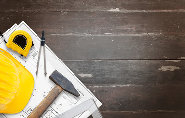 house construction tools on wooden table with free space for text.