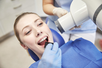 Poster - female patient face with x-ray machine and shield