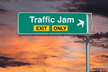 Traffic Jam Exit Only Freeway Sign With Sunrise Sky