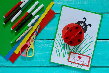 Wall Mural - Colorful paper card with ladybug, grass, and the words I love su