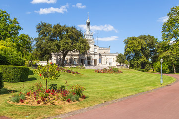 Wall Mural - cognac, france. the picturesque city park and the city hall building