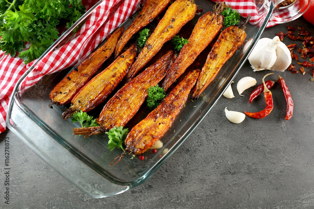 Tasty grilled carrots in glass bowl