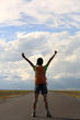 © lzf - young woman hiker open arms at beautiful mountain trail