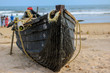 Wooden fishing boat on a sea shore. These country boats are extensively used for fishing all along the Indian coastal line.