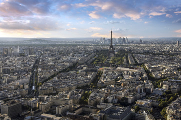 Canvas Print - Eiffel Tower and Paris cityscape from above in orange sunset sunlight, France