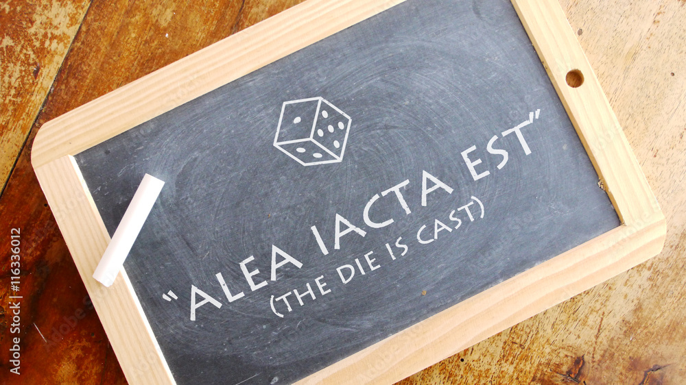 Alea iacta est. A Latin phrase meaning "The die is cast”. Stock Photo Adobe Stock