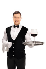 Sticker - Waiter holding a tray with red wine