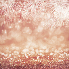 Wall Mural - defocused rose gold fireworks and blurred bokeh at new year and copy space. abstract background holi