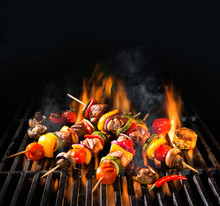 Meat Kebabs With Vegetables On Flaming Grill