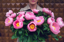 Woman Holding Bouquet Of Pink Flowers