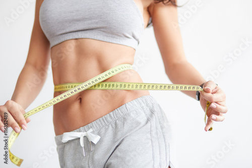 Fotografia Woman measuring her waistline. Perfect Slim Body