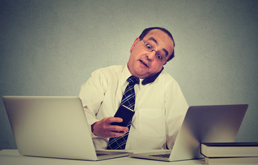 Multitasking business man working at office desk. Busy life of company manager