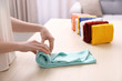 Woman folding clothes on table