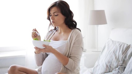 Canvas Print - pregnant woman eating salad in bed at home 3